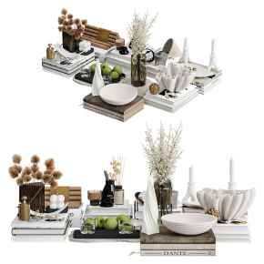 A decorative set with apples and many books.