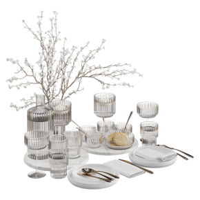 Table setting with branches in a vase.