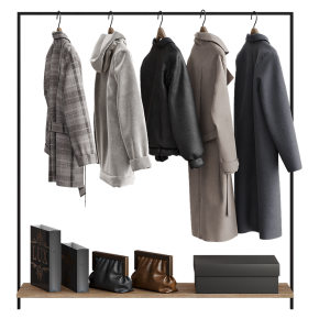 Floor-standing coat rack with outerwear.