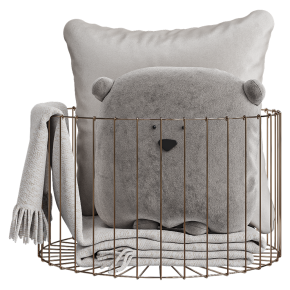 Pillows with a blanket in the basket.