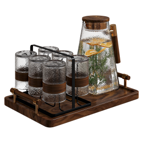 A decorative kitchen set with a decanter and glasses.