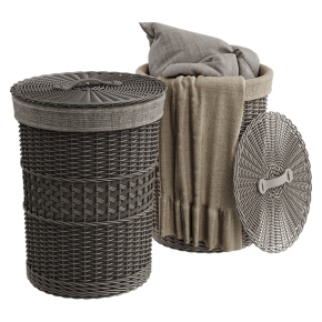 A woven basket with a cushion and a throw