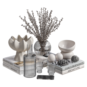 A decorative set with a decanter, glasses, and a telephone.